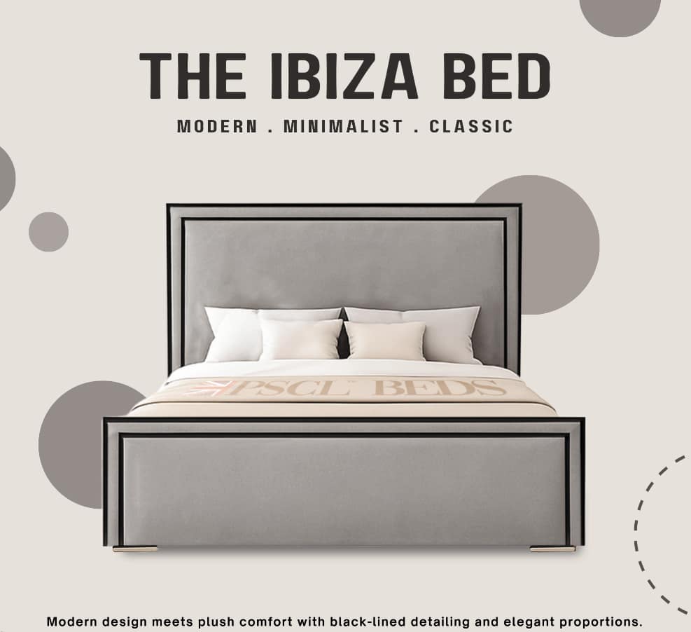 a bed with a grey headboard
